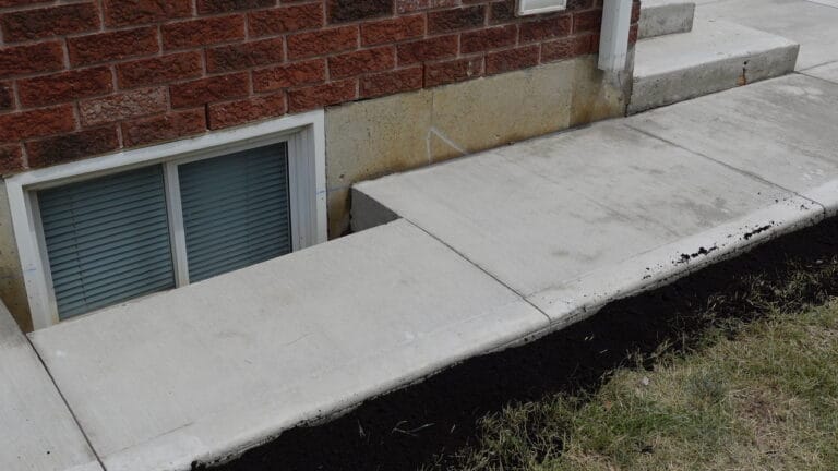 Concrete patios extension near basement window