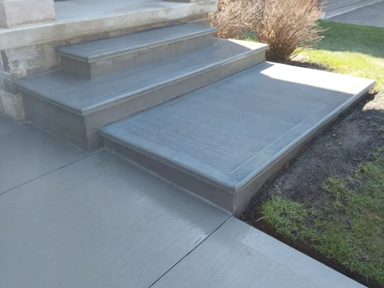 Custom poured concrete front steps with smooth finish